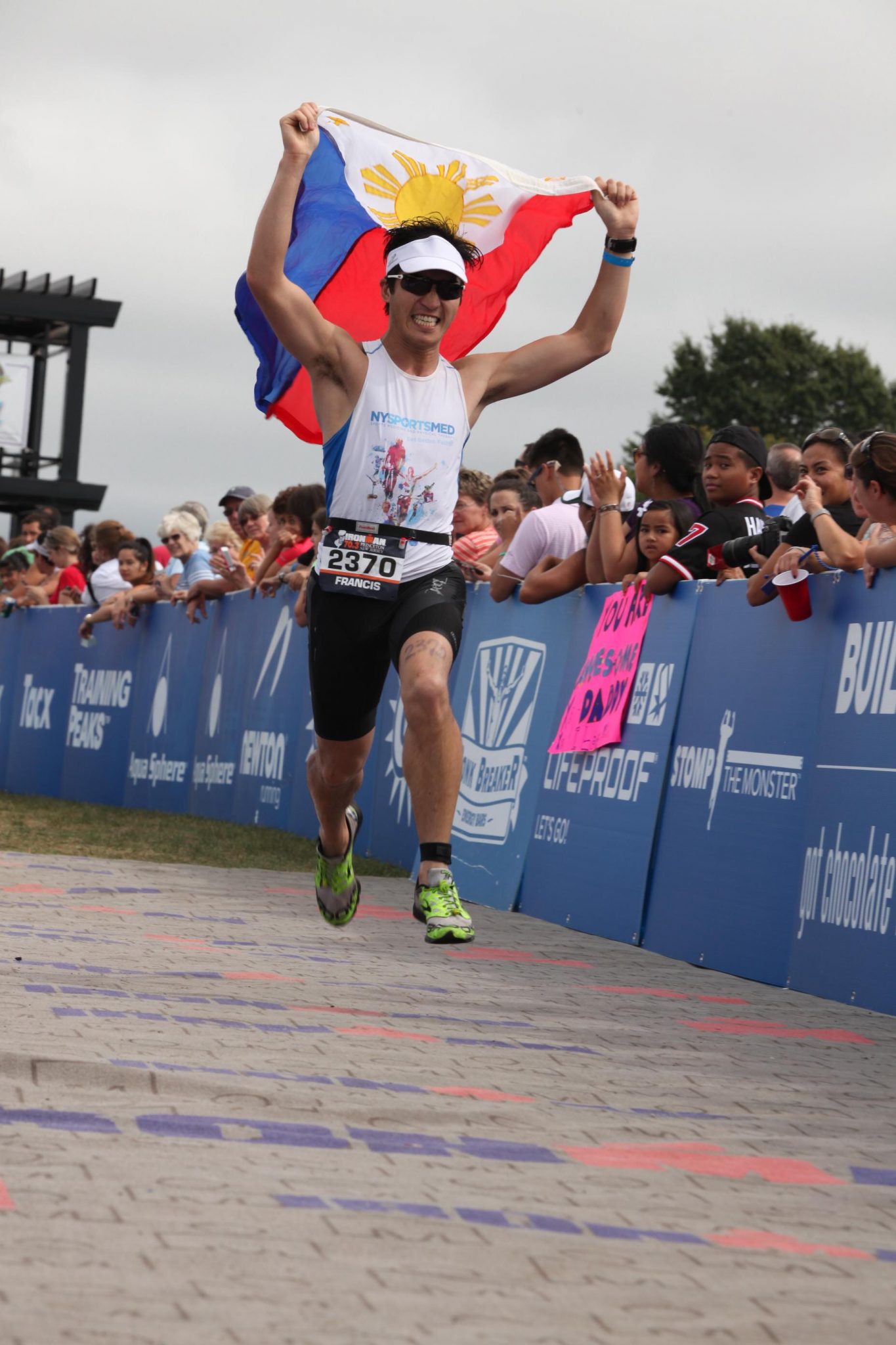 Francis Diano sprinting towards the end of Ironman 70.3 Princeton