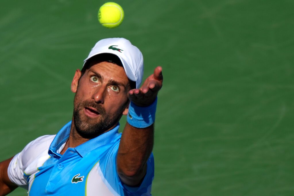Aug 20, 2023; Mason, OH, USA; Novak Djokovic, of Serbia, serves to Carlos Alcaraz, of Spain, during the menĆs singles final of the Western & Southern Open tennis tournament at Lindner Family Tennis Center. Mandatory Credit: Kareem Elgazzar/The Enquirer-USA TODAY Sports
