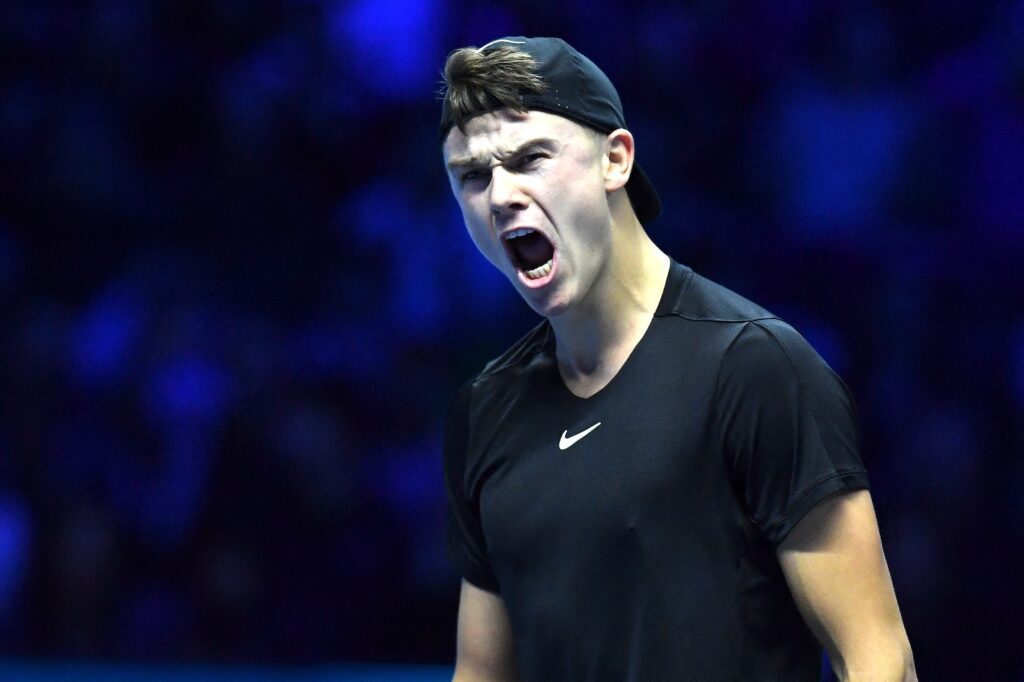 Denmark's Holger Rune reacts during the first round robin match against Serbia's Novak Djokovic at the ATP Finals tennis tournament in Turin