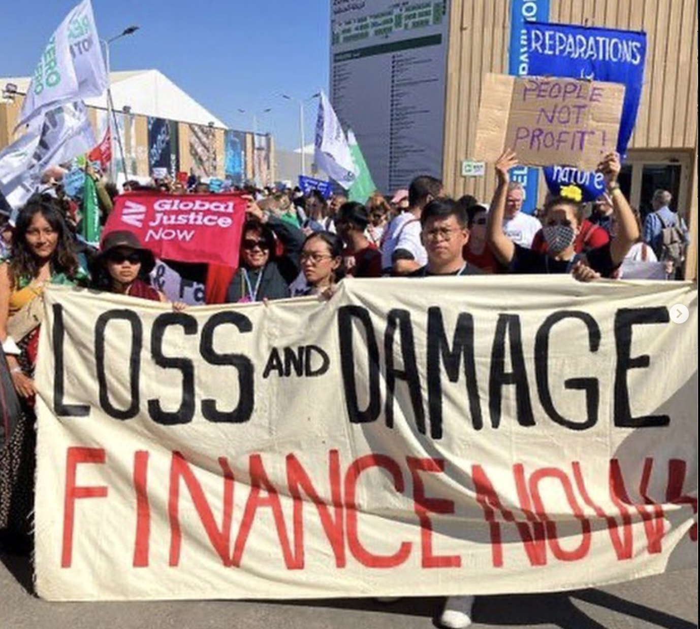 Joy Reyes with fellow climate and environmental advocates during a rally calling attention to the damagesfrom human activities worsening climate change